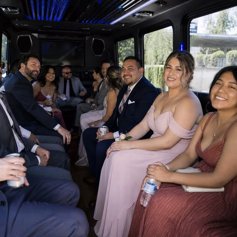Wedding guests seated inside a Stockton party bus