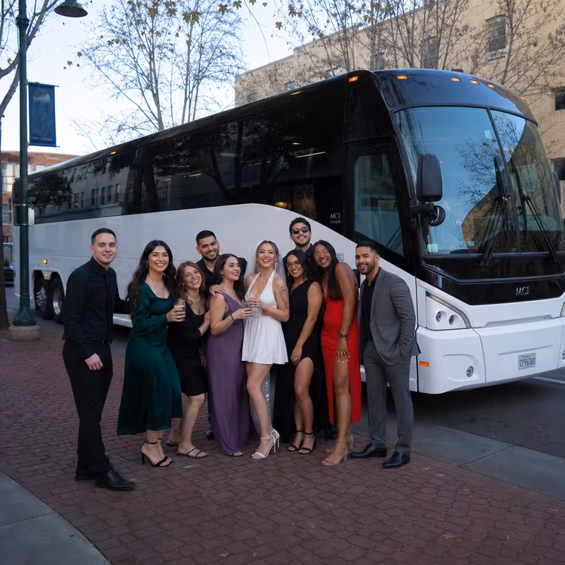 Passengers loading luggage while boarding an Stockton group shuttle