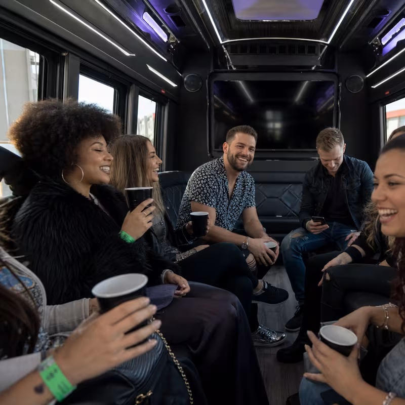 Passengers loading luggage while boarding an Stockton group shuttle