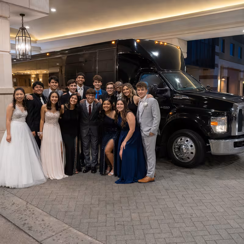 Party bus interior with wraparound leather seating and LED lighting in Stockton