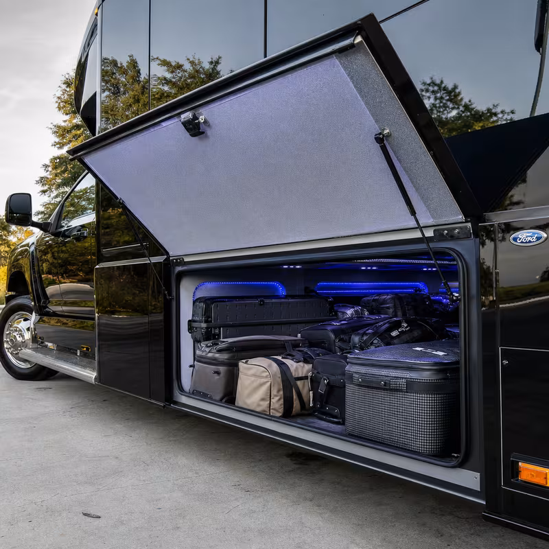 Party bus interior with wraparound leather seating and LED lighting in Stockton