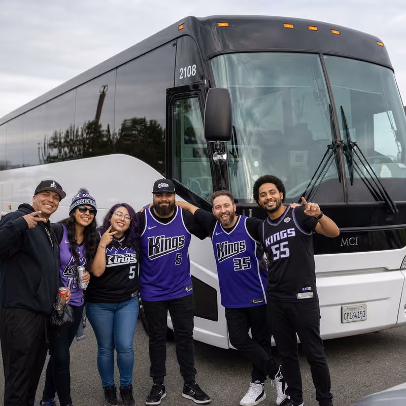 Passengers loading luggage while boarding an Stockton group shuttle