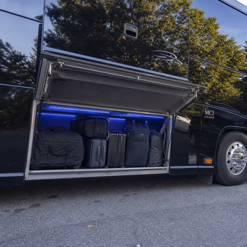 Party bus interior with wraparound leather seating and LED lighting in Stockton